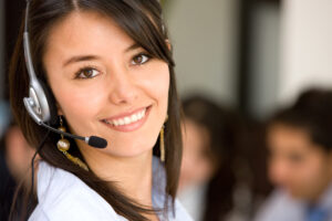 beautiful business customer service woman - smiling in an office